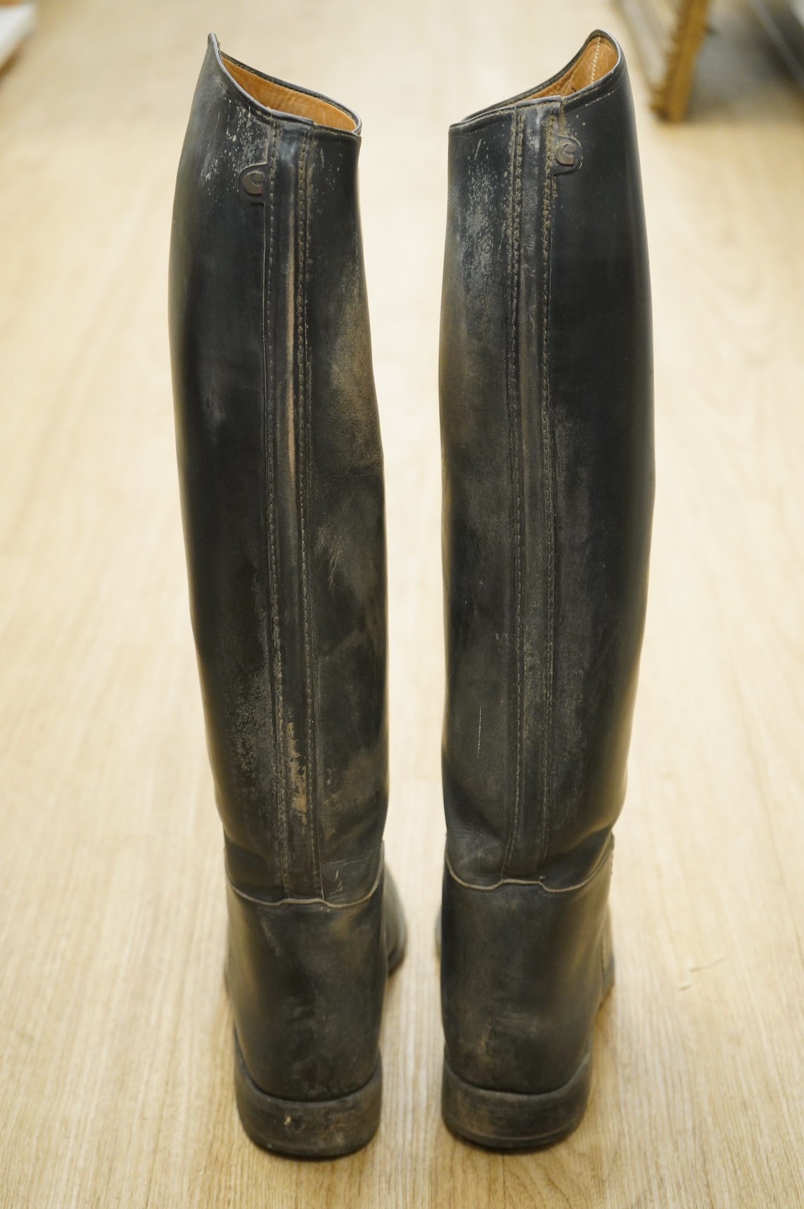 A pair of 20th century black leather riding boots